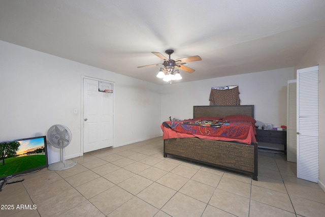 tiled bedroom with ceiling fan