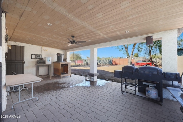 view of patio / terrace featuring an outdoor kitchen and ceiling fan