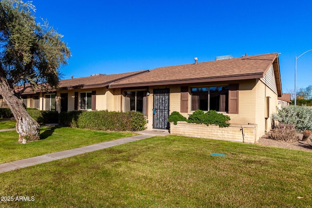 ranch-style house with a front yard