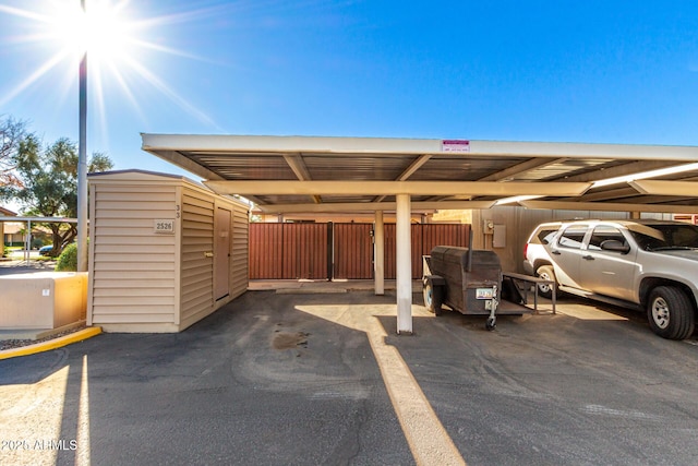 view of parking featuring a carport