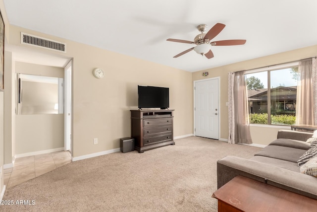 carpeted living room featuring ceiling fan