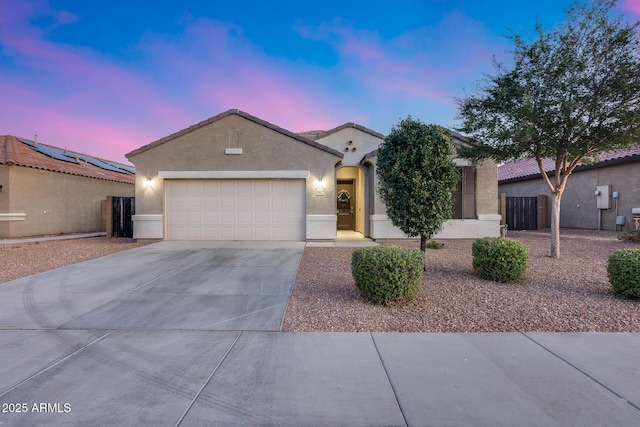 13657 W Paso Trl, Peoria, AZ 85383 - view of front facade featuring concrete driveway, an attached garage, and stucco siding