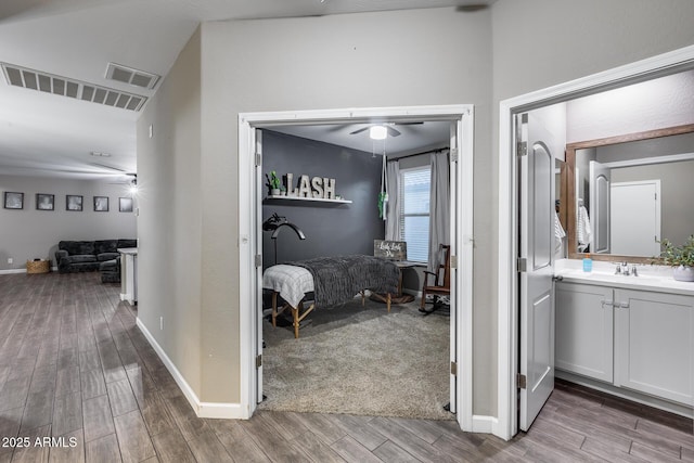 13657 W Paso Trl, Peoria, AZ 85383 - corridor with wood finished floors, a sink, and baseboards