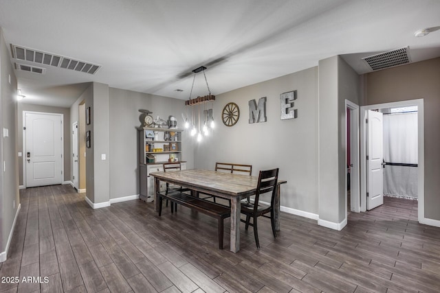 13657 W Paso Trl, Peoria, AZ 85383 - dining area featuring dark wood-style flooring and baseboards