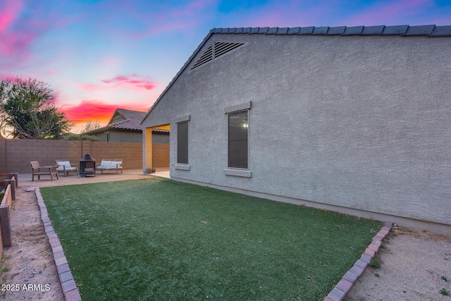 13657 W Paso Trl, Peoria, AZ 85383 - yard at dusk featuring a patio area