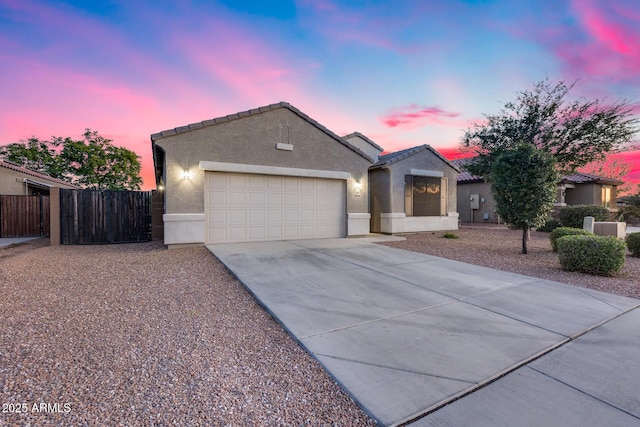 13657 W Paso Trl, Peoria, AZ 85383 - ranch-style home with stucco siding, an attached garage, fence, driveway, and a tiled roof