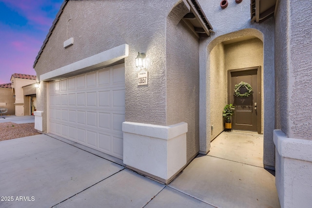 13657 W Paso Trl, Peoria, AZ 85383 - garage at dusk featuring driveway