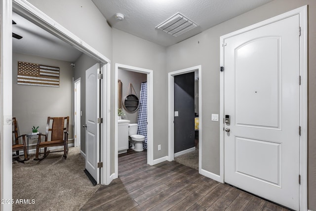 13657 W Paso Trl, Peoria, AZ 85383 - entryway featuring dark wood-type flooring and baseboards