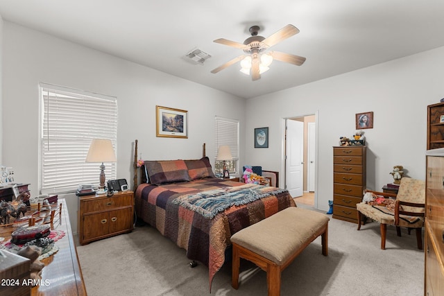 bedroom featuring ceiling fan and light colored carpet