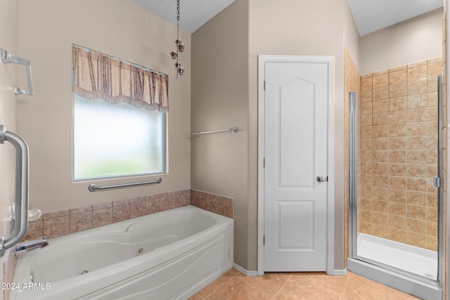 bathroom featuring independent shower and bath and tile patterned flooring