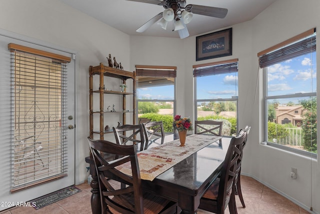 dining room with light tile patterned floors and ceiling fan