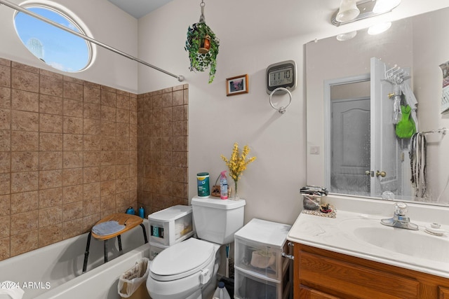 full bathroom featuring vanity, toilet, and tiled shower / bath