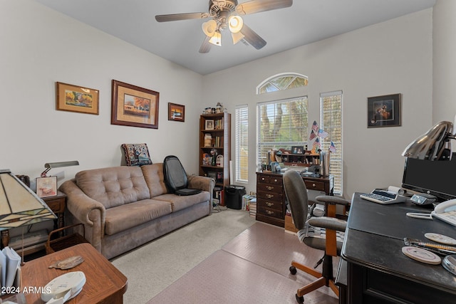 carpeted office space featuring ceiling fan