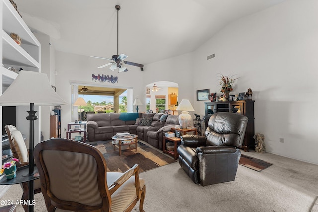 living room featuring carpet floors, high vaulted ceiling, and ceiling fan