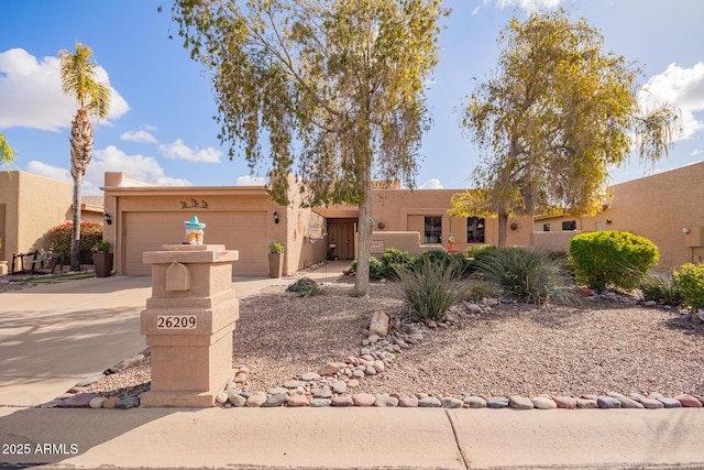 southwest-style home featuring a garage