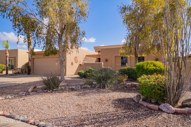 adobe home featuring a garage