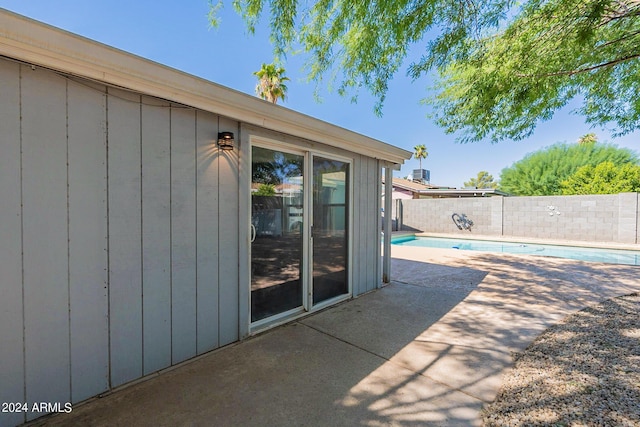 view of patio / terrace with a fenced backyard and a fenced in pool