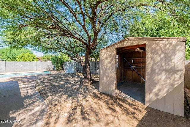 view of shed with a fenced backyard