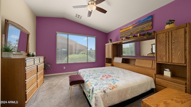 bedroom featuring lofted ceiling, light colored carpet, a ceiling fan, baseboards, and visible vents