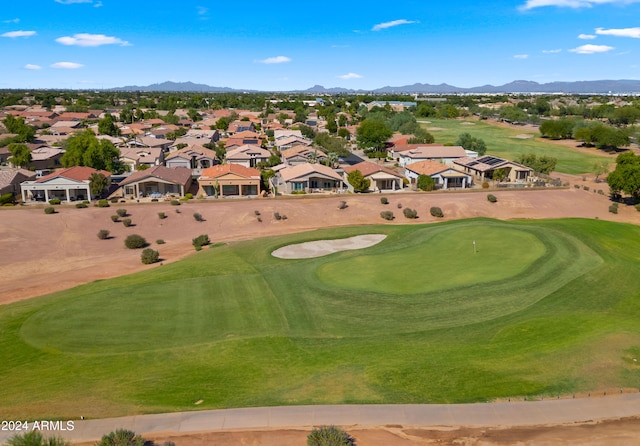 view of community featuring view of golf course, a residential view, and a mountain view