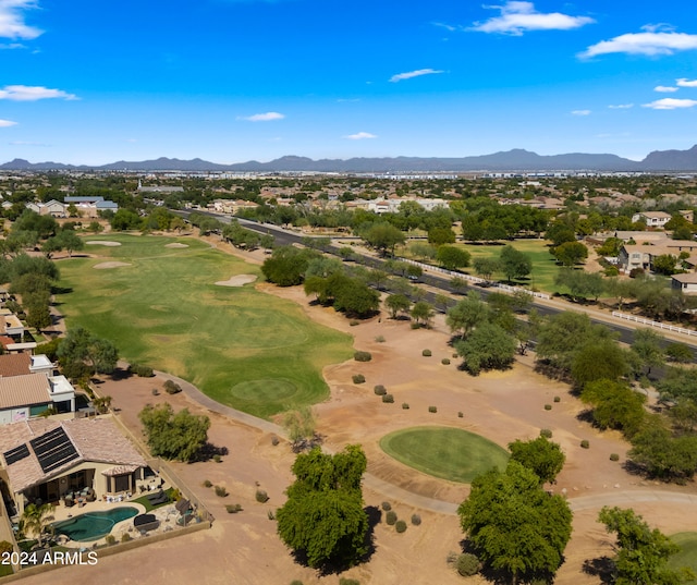 bird's eye view with view of golf course and a mountain view