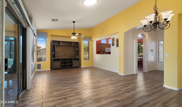 foyer entrance with dark wood-style floors, arched walkways, lofted ceiling, visible vents, and baseboards