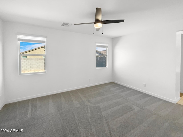 unfurnished room featuring carpet and ceiling fan