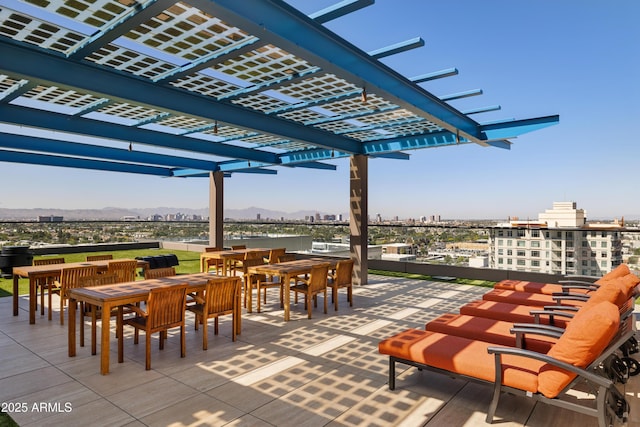 4808 N 24th St Unit 1228, Phoenix, AZ 85016 - view of patio with outdoor dining area, a pergola, a city view, and a mountain view