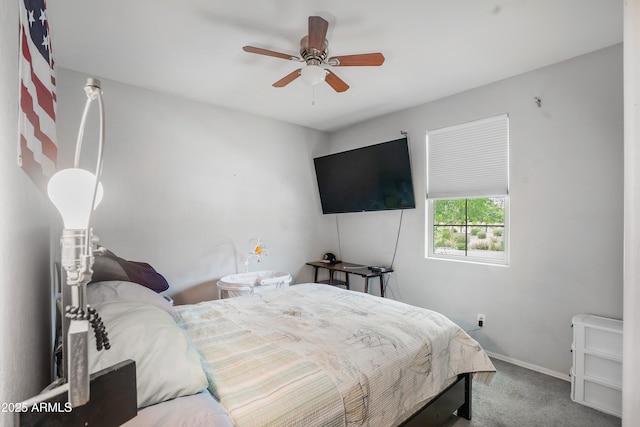 3828 E Liberty Ln, Gilbert, AZ 85296 - bedroom with carpet flooring, baseboards, and a ceiling fan