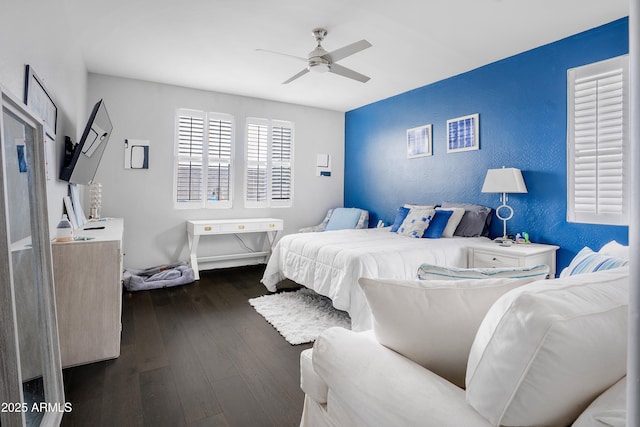 3828 E Liberty Ln, Gilbert, AZ 85296 - bedroom with dark wood-style flooring, a ceiling fan, and a textured wall