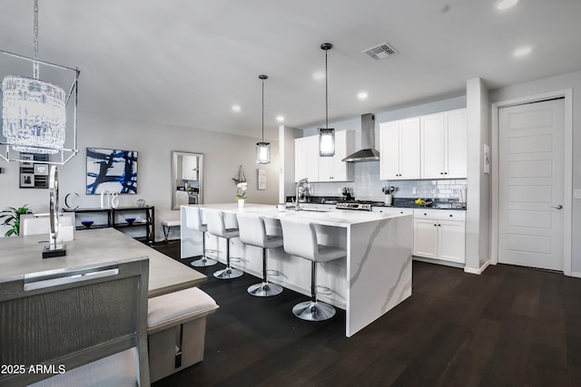 3828 E Liberty Ln, Gilbert, AZ 85296 - kitchen featuring wall chimney exhaust hood, dark wood-style floors, backsplash, recessed lighting, and a sink