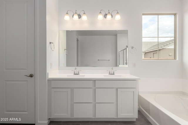 full bathroom with a garden tub, a shower with shower door, a sink, and double vanity