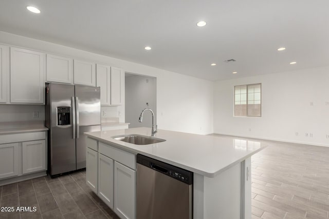 kitchen featuring a sink, light countertops, appliances with stainless steel finishes, visible vents, and recessed lighting