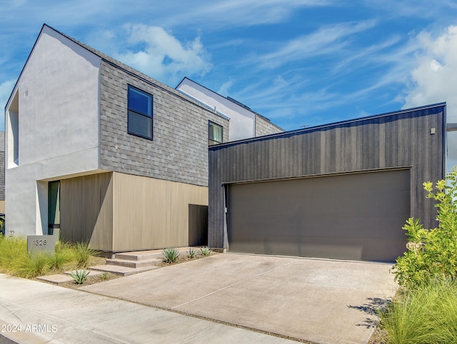 contemporary home featuring an outbuilding