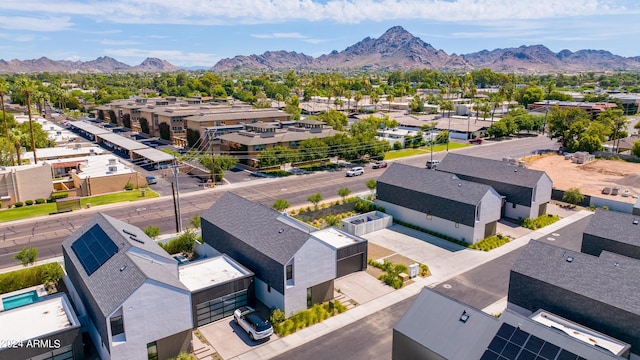 birds eye view of property with a mountain view and a residential view