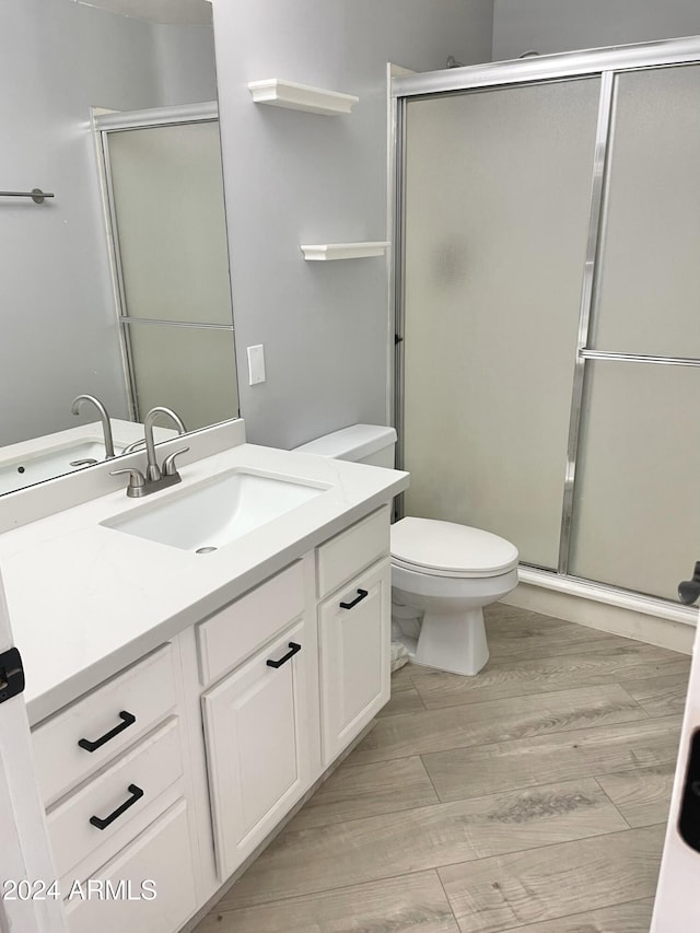 bathroom with vanity and an enclosed shower