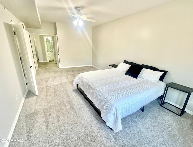 bedroom with ceiling fan and light colored carpet