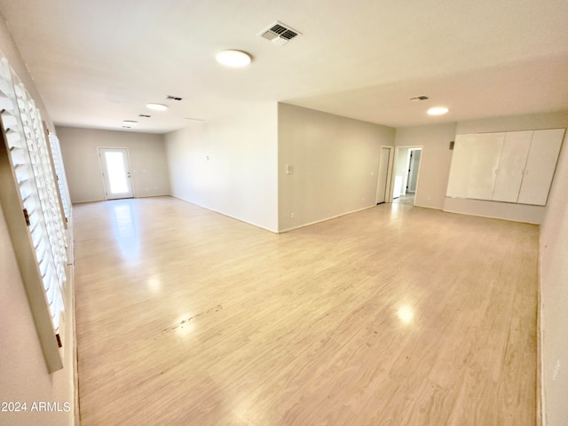 unfurnished room with light hardwood / wood-style flooring