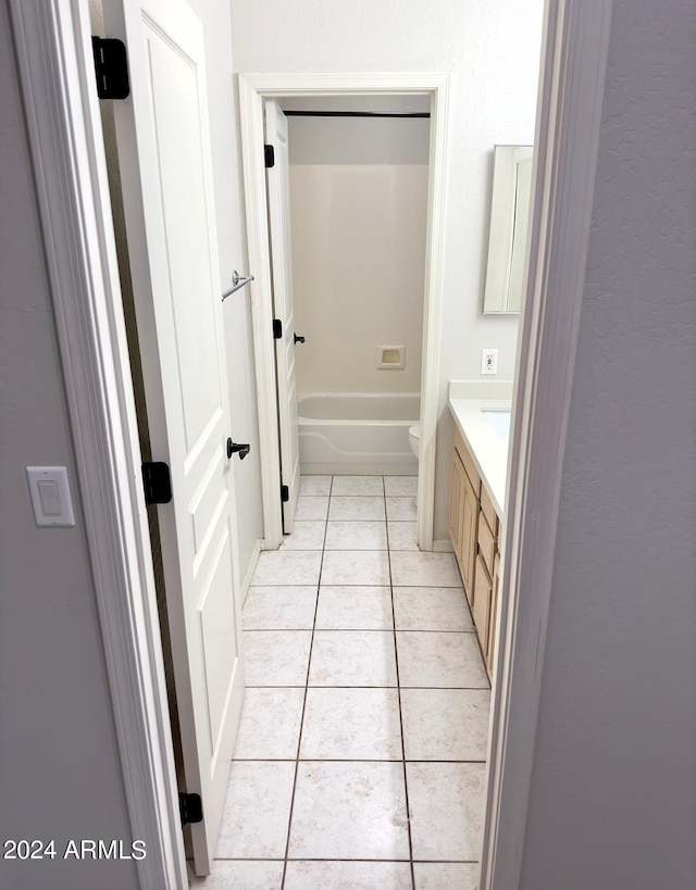 bathroom with vanity, toilet, and tile patterned floors