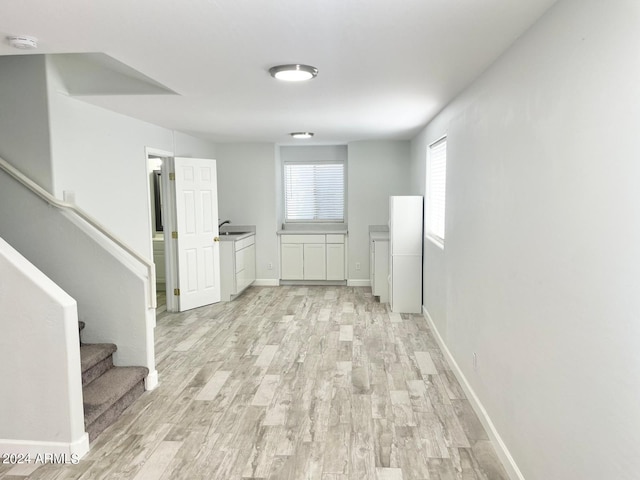 hallway with light wood-type flooring