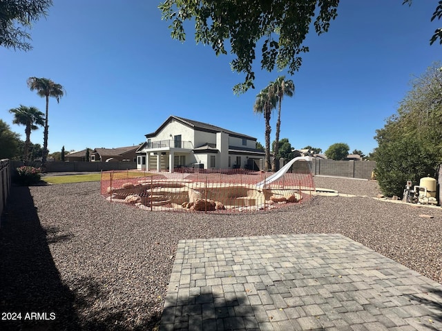 view of yard with a patio and a balcony