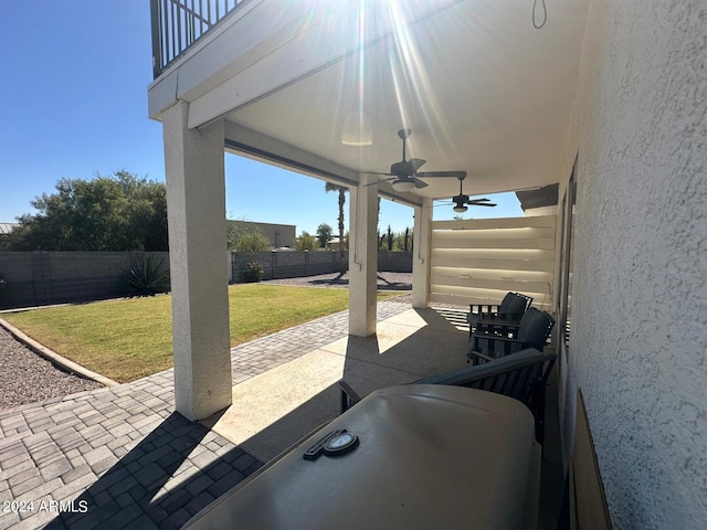 view of patio / terrace featuring ceiling fan