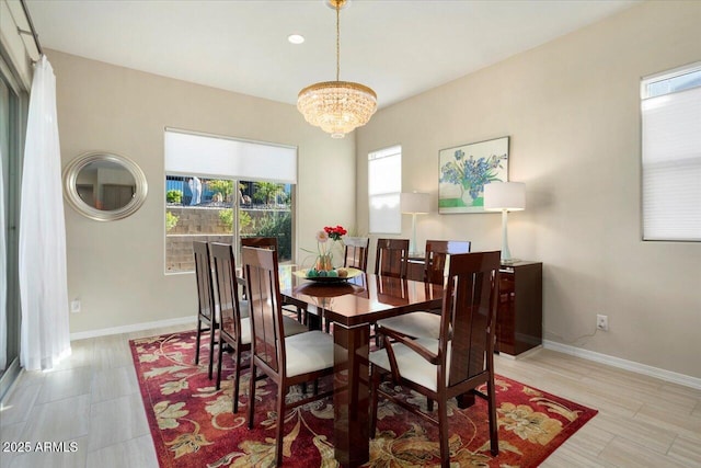 dining space featuring a chandelier