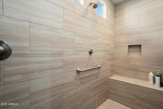 bathroom with tiled shower