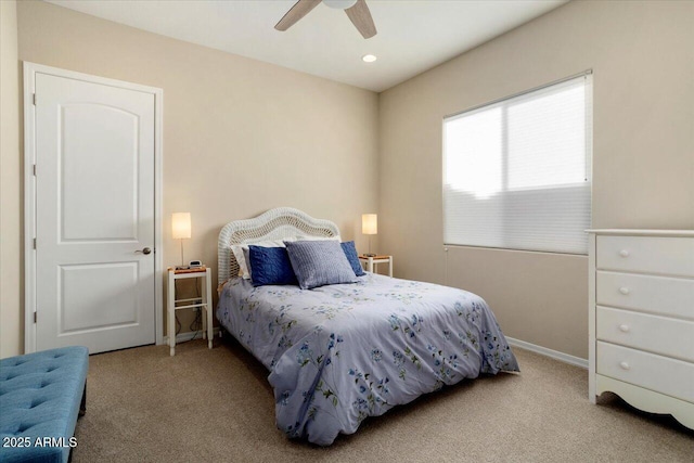 carpeted bedroom with ceiling fan