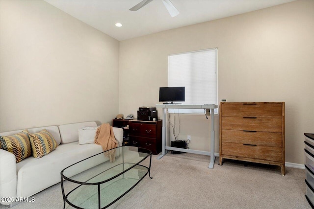 carpeted living room featuring ceiling fan