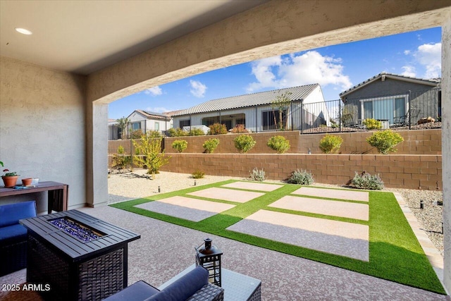 view of patio featuring a fire pit