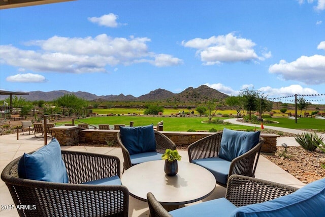 view of patio / terrace featuring a mountain view