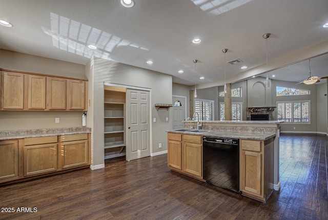 kitchen featuring pendant lighting, a kitchen island with sink, dishwasher, and sink