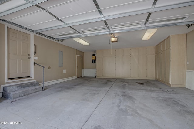 garage featuring a garage door opener and electric panel